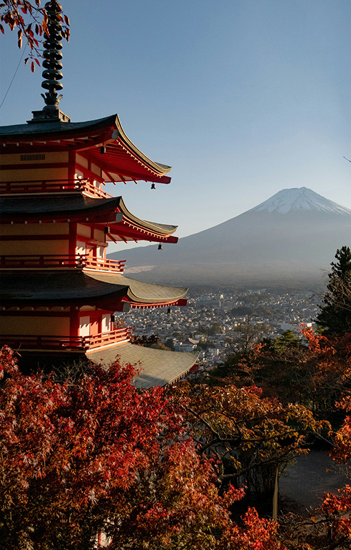 Japanese temple in the foreground with Mount Fuji in the background.