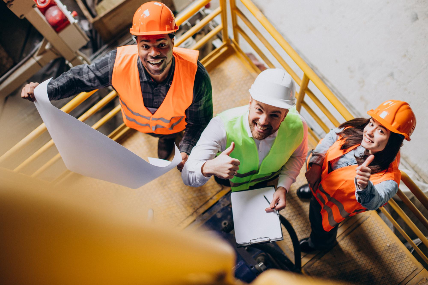 apprentices with their supervisors on a construction site