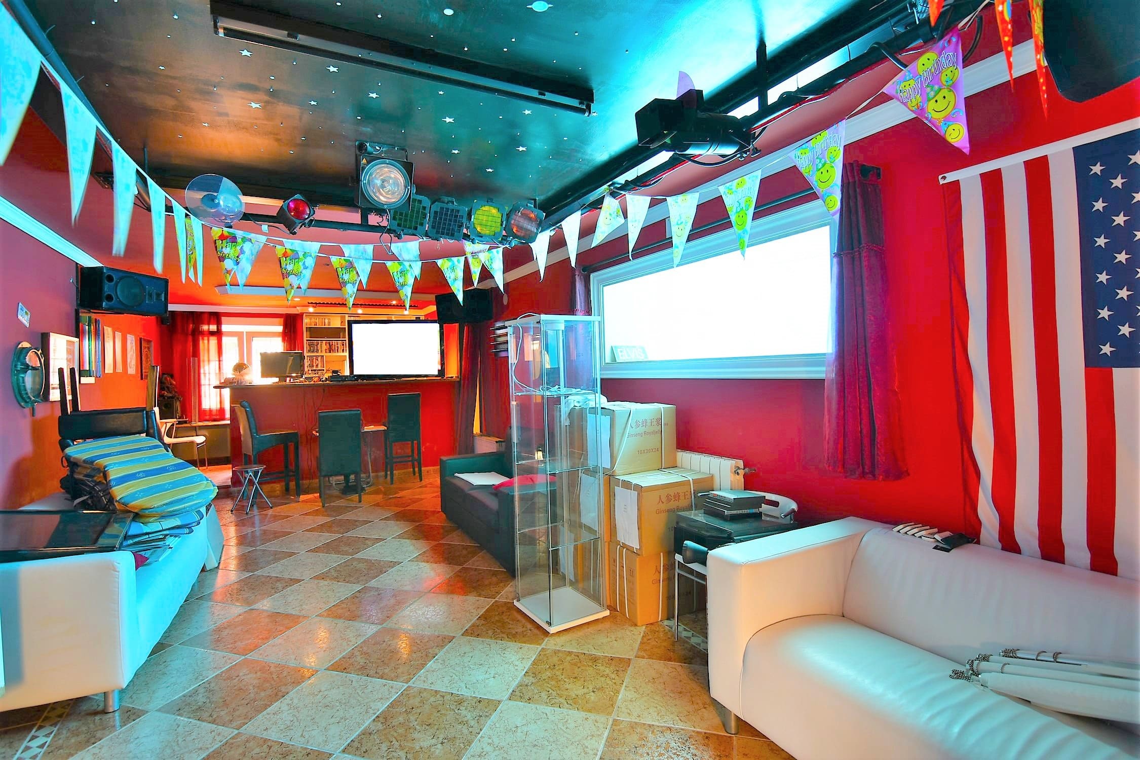 Private disco party room at the villa with a bar, professional lighting, and a starry sky ceiling.