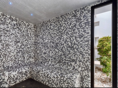 Professional sauna with mosaic tiles in luxury villa spa zone - premium wellness facilities
