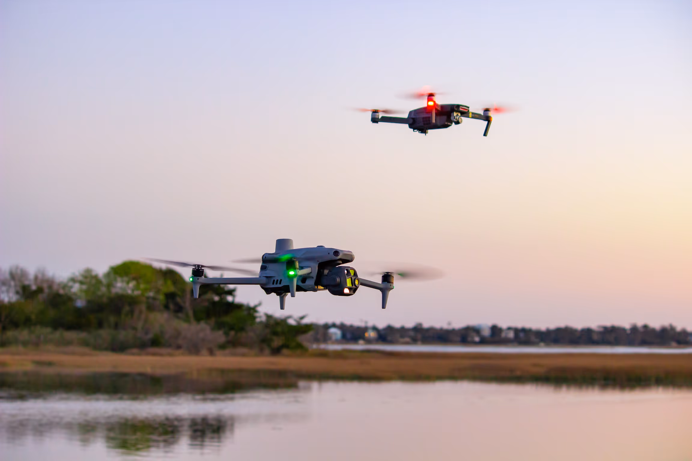 Two of Wildblues aerial drones over the waterfront of eastern north carolina