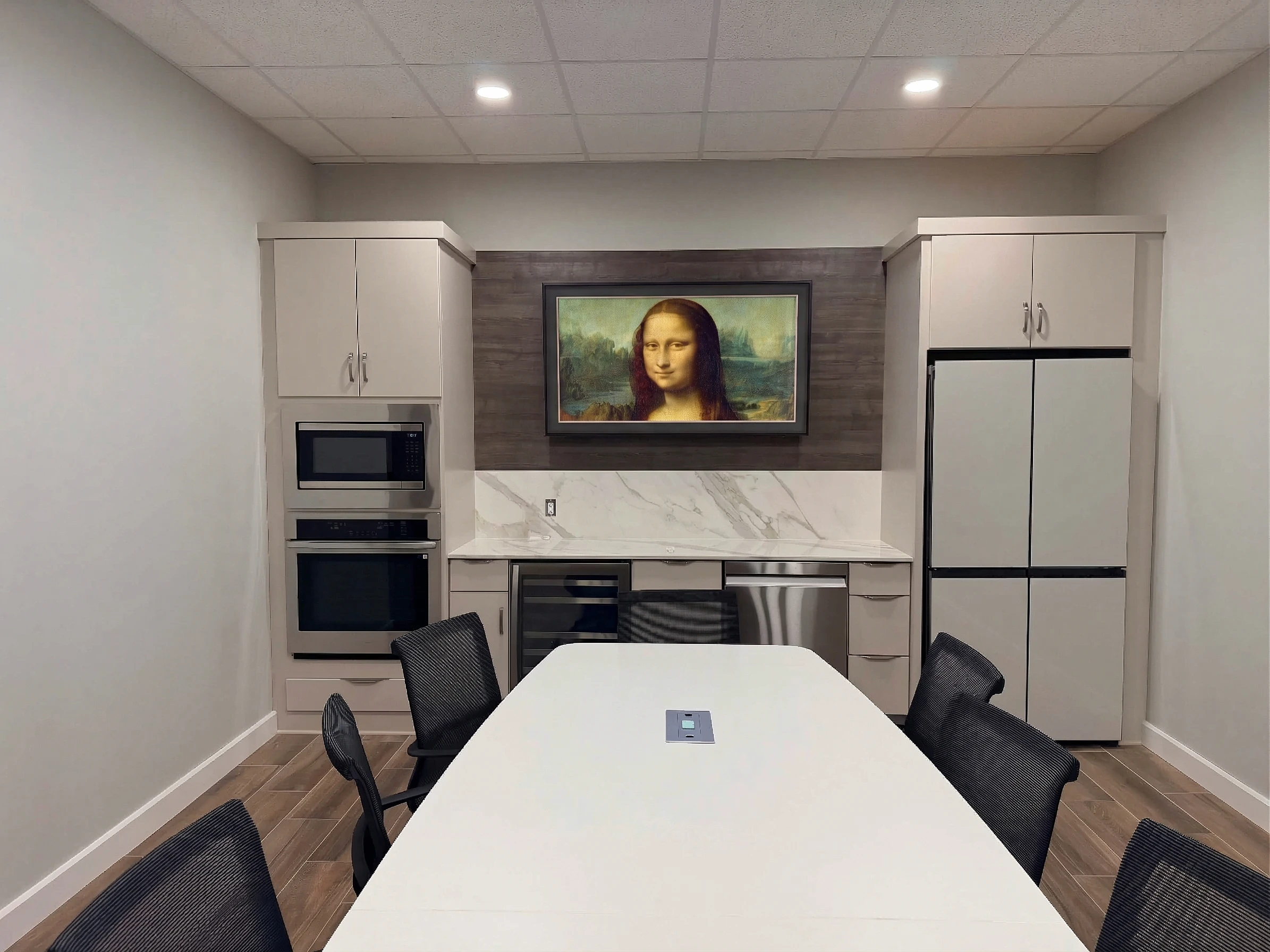 65-inch Samsung Frame TV with Mona Lisa art mode in St. Paul conference room