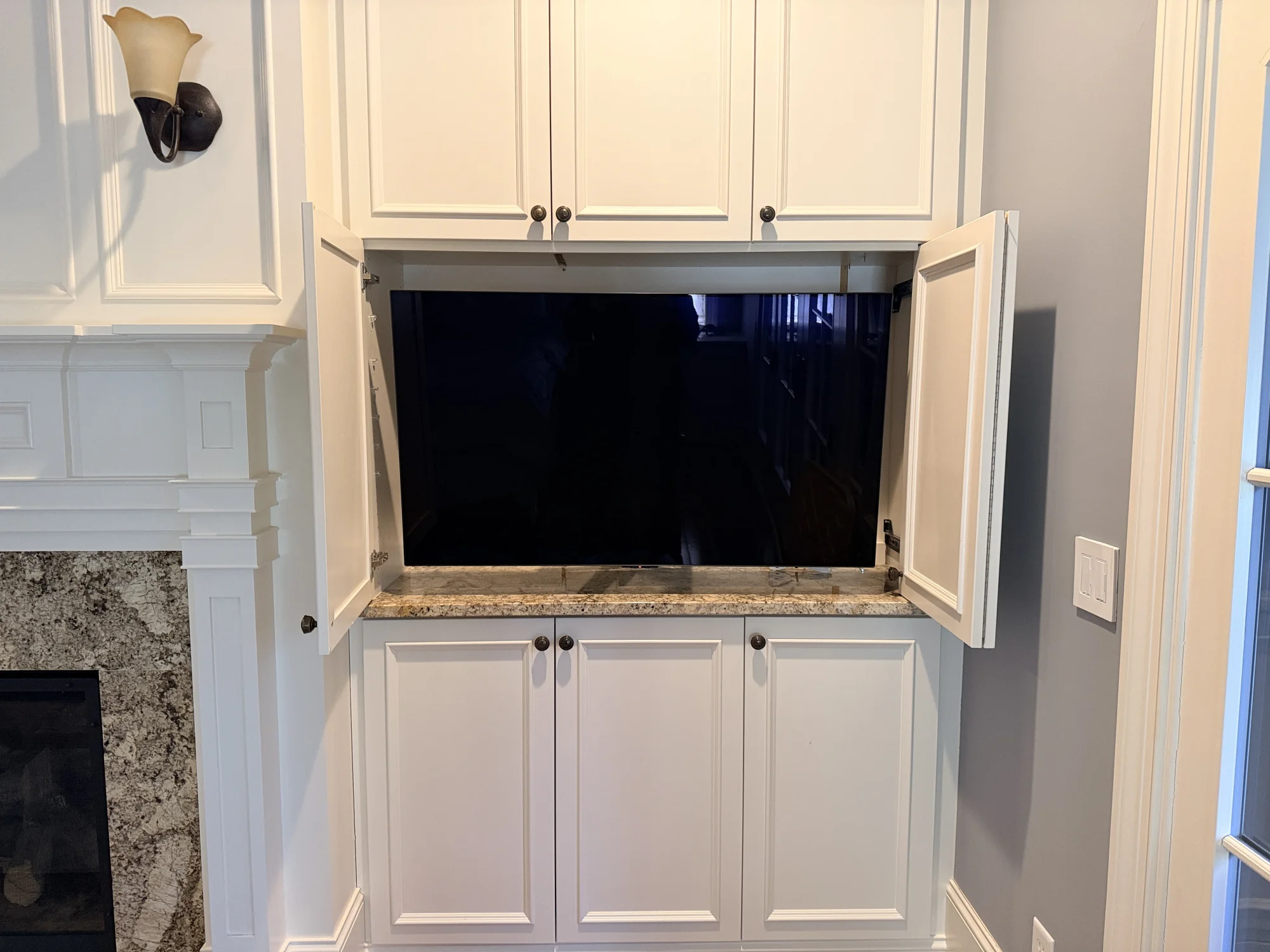 50" TV installation on wood slats near West Lake Harriet Parkway in Minneapolis