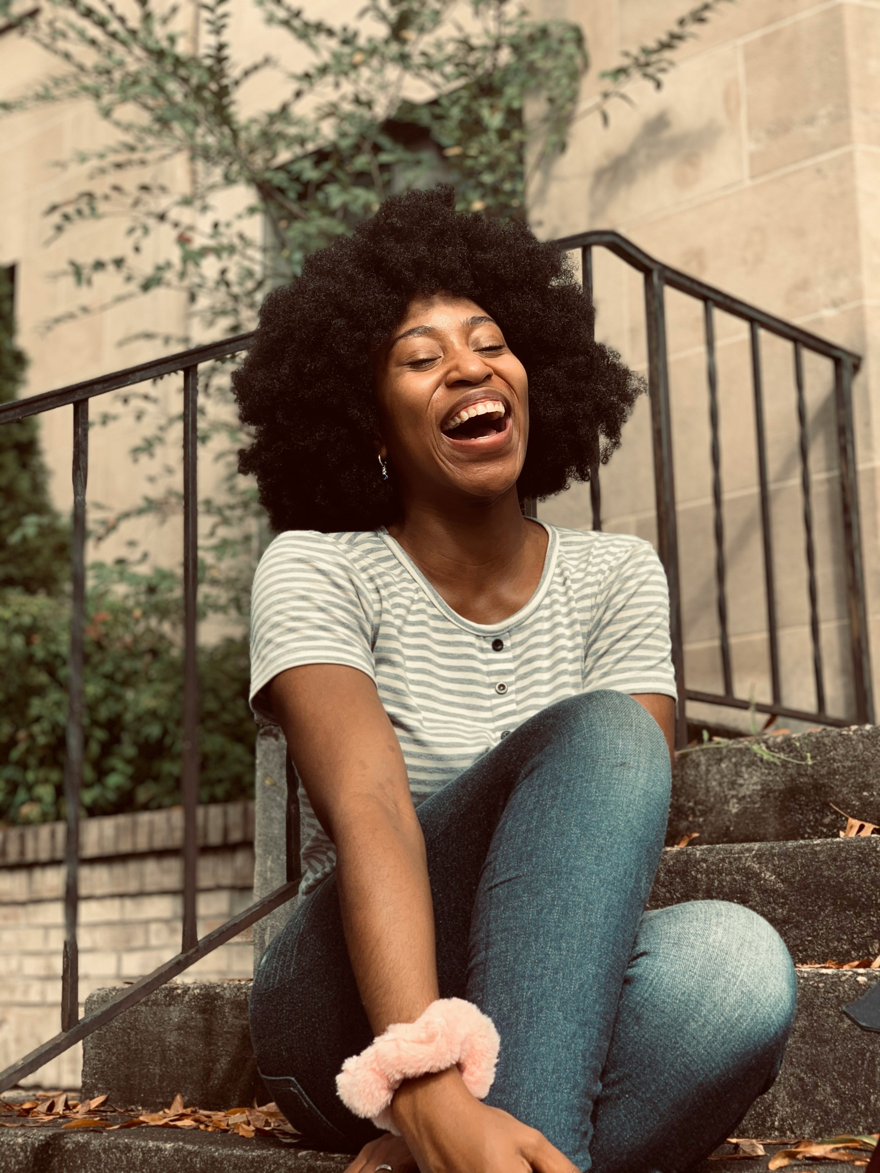 lady on steps cheerfully smiling