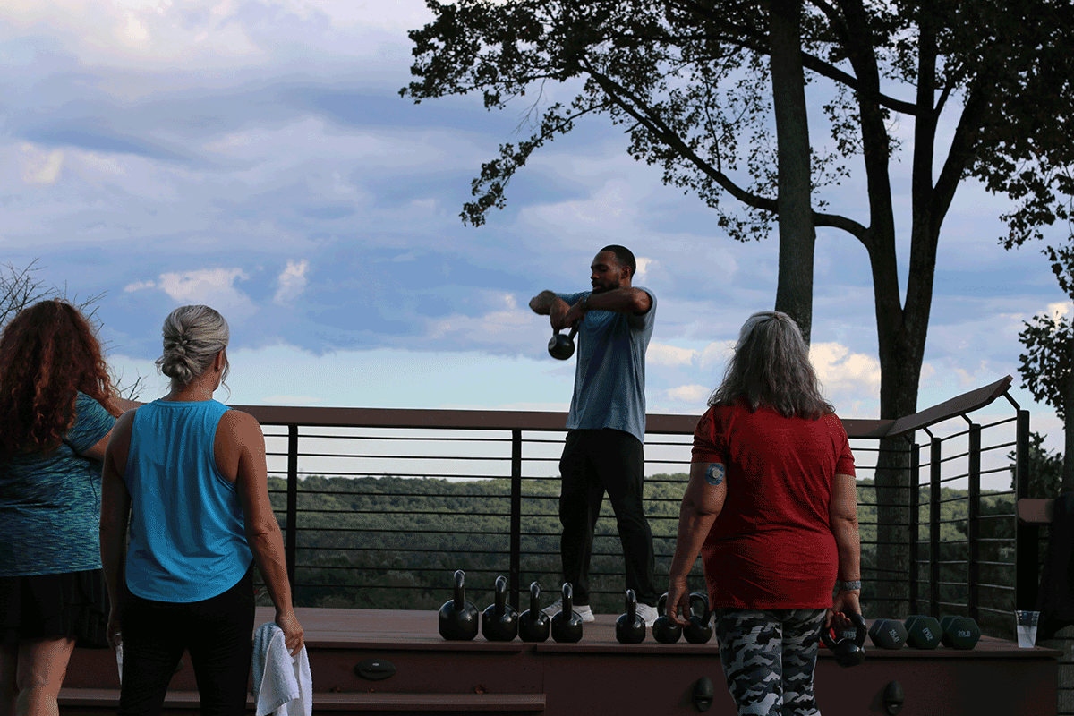 Trainer Nick Rainey instructing his class on a movement