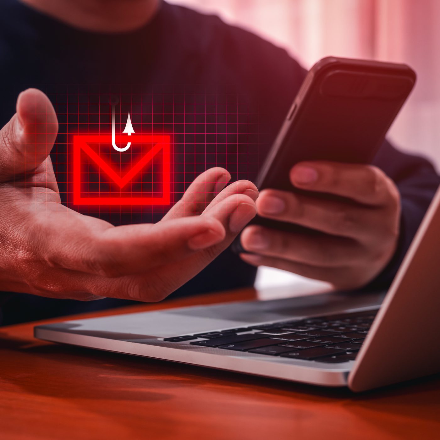 Icône d'hameçonnage : enveloppe rouge et hameçon au-dessus d'un téléphone