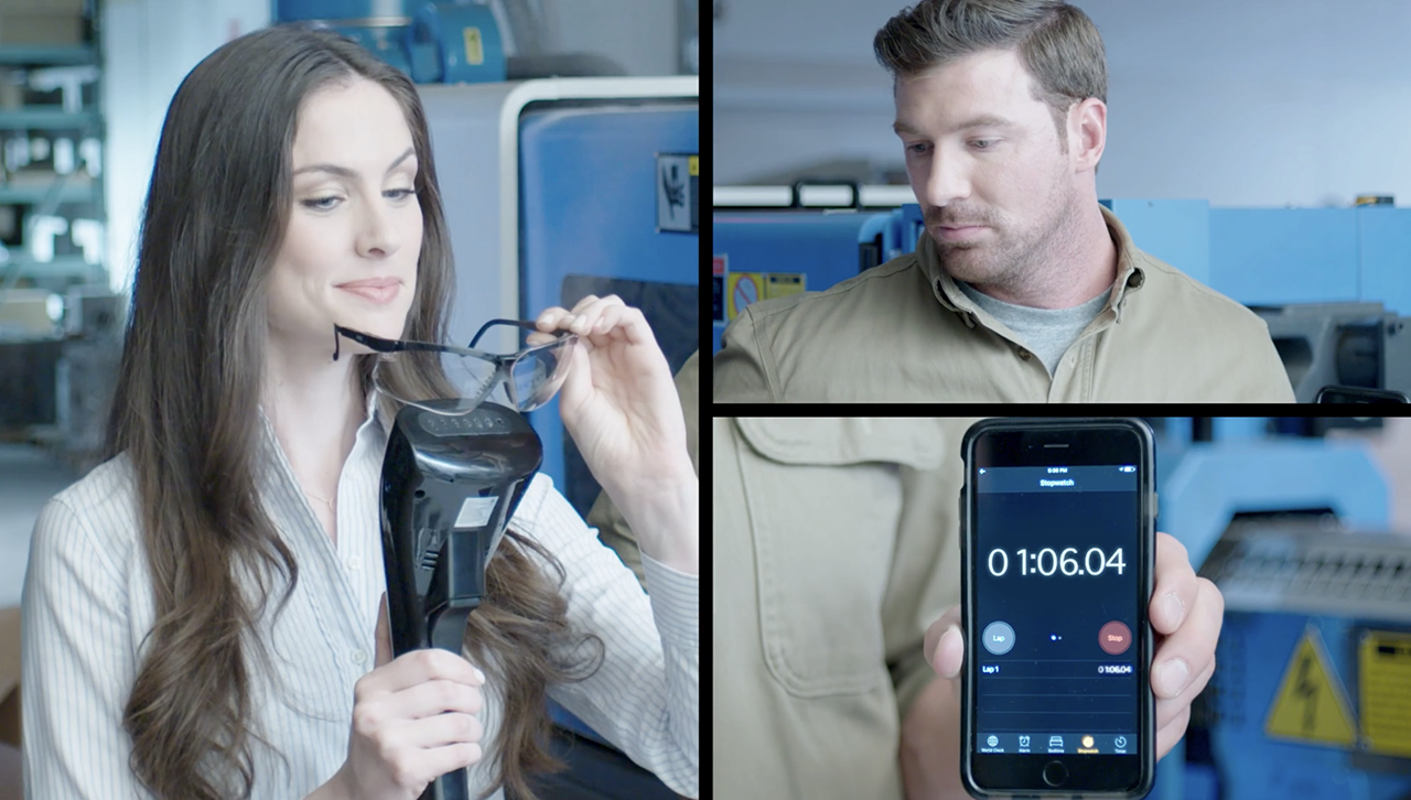 Two people demonstrate a medical device, with one holding equipment and the other showing a digital display with a timer