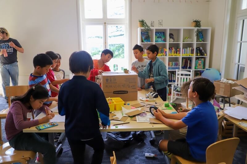 A data spreadsheet chart comparing weekly costs, discount percentages, and registration deadlines for Bay Area STEM and private school summer programs