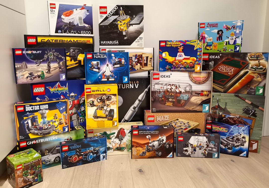 A stack of boxed LEGO sets from the Brick Box Club library