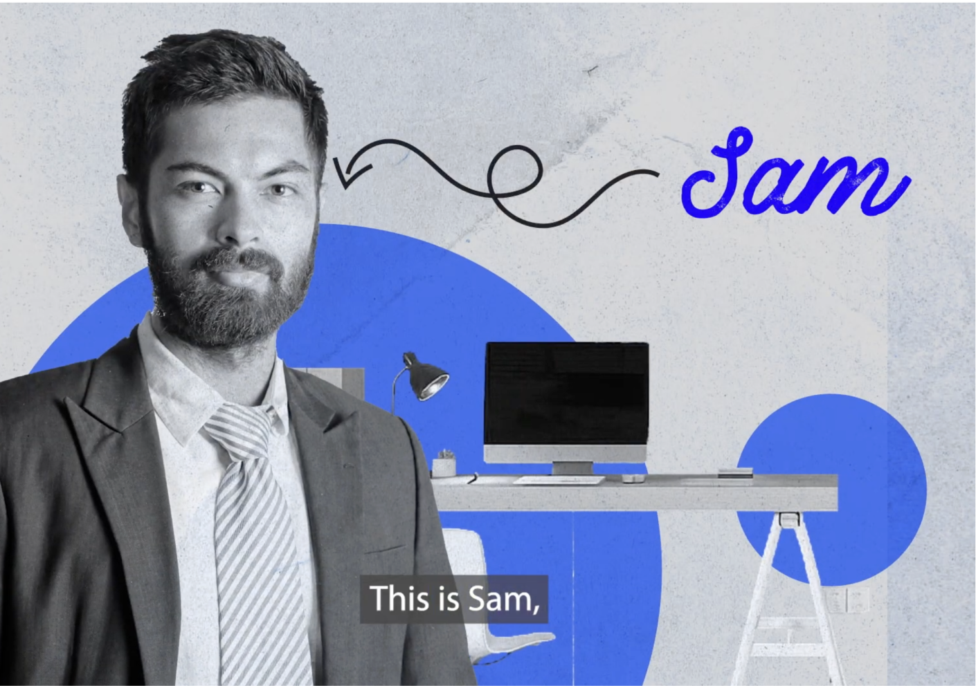 A man standing in front of a desk with a computer on it.