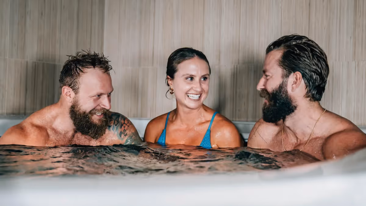 Two men and a woman in the pool