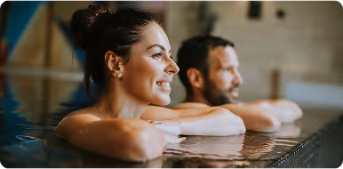 a man and woman starring in the pool