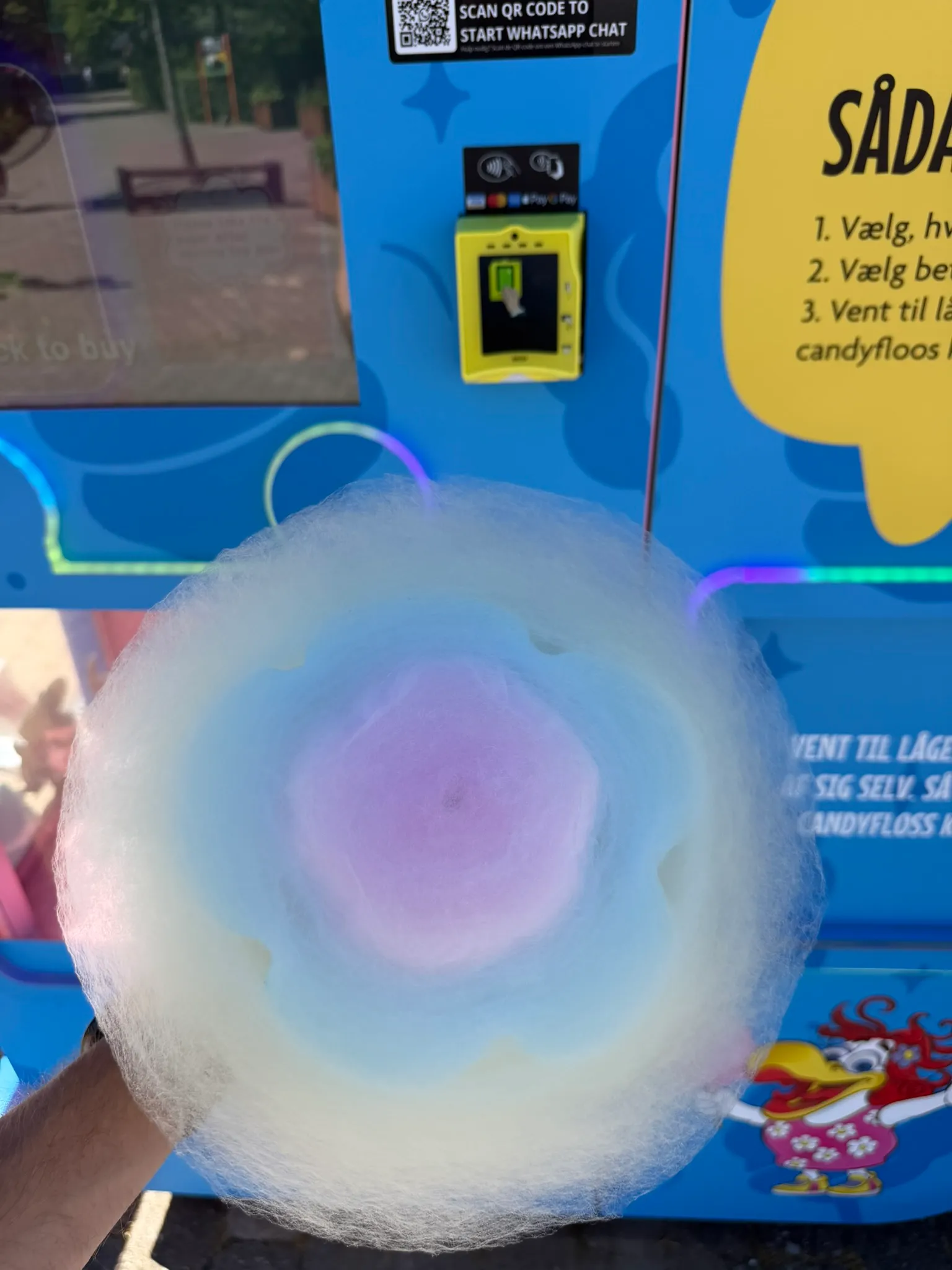 Rainbow cotton candy flower freshly spun by a Vend-Me machine