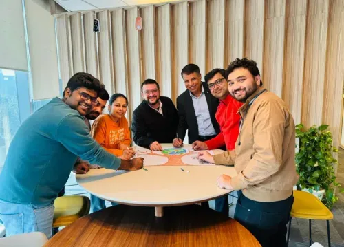 Exicom team collaborating around a table.