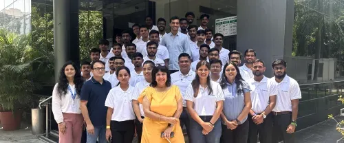staff group photo outside office building.