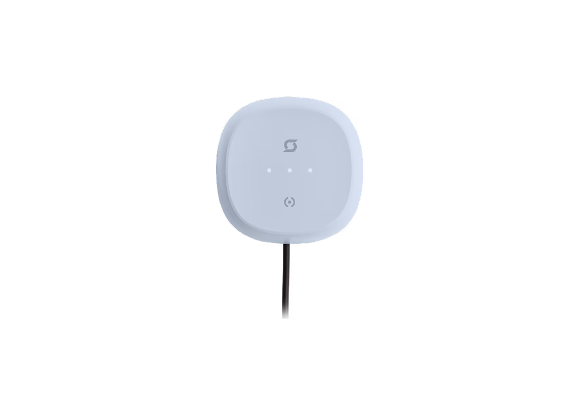 Exicom Spin wall-mounted EV charger on dark background.