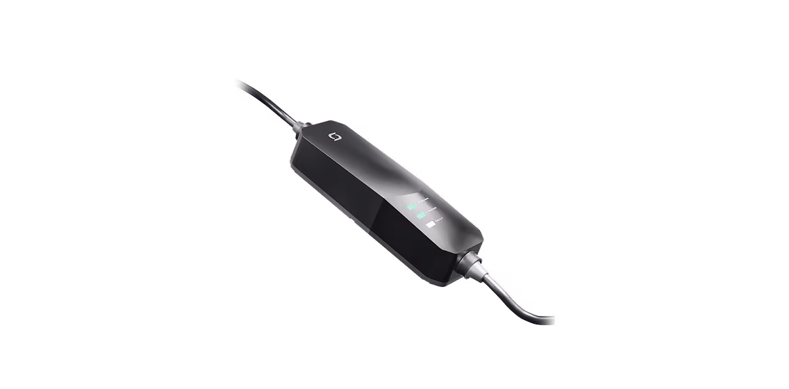 Portable EV charger device on dark background.