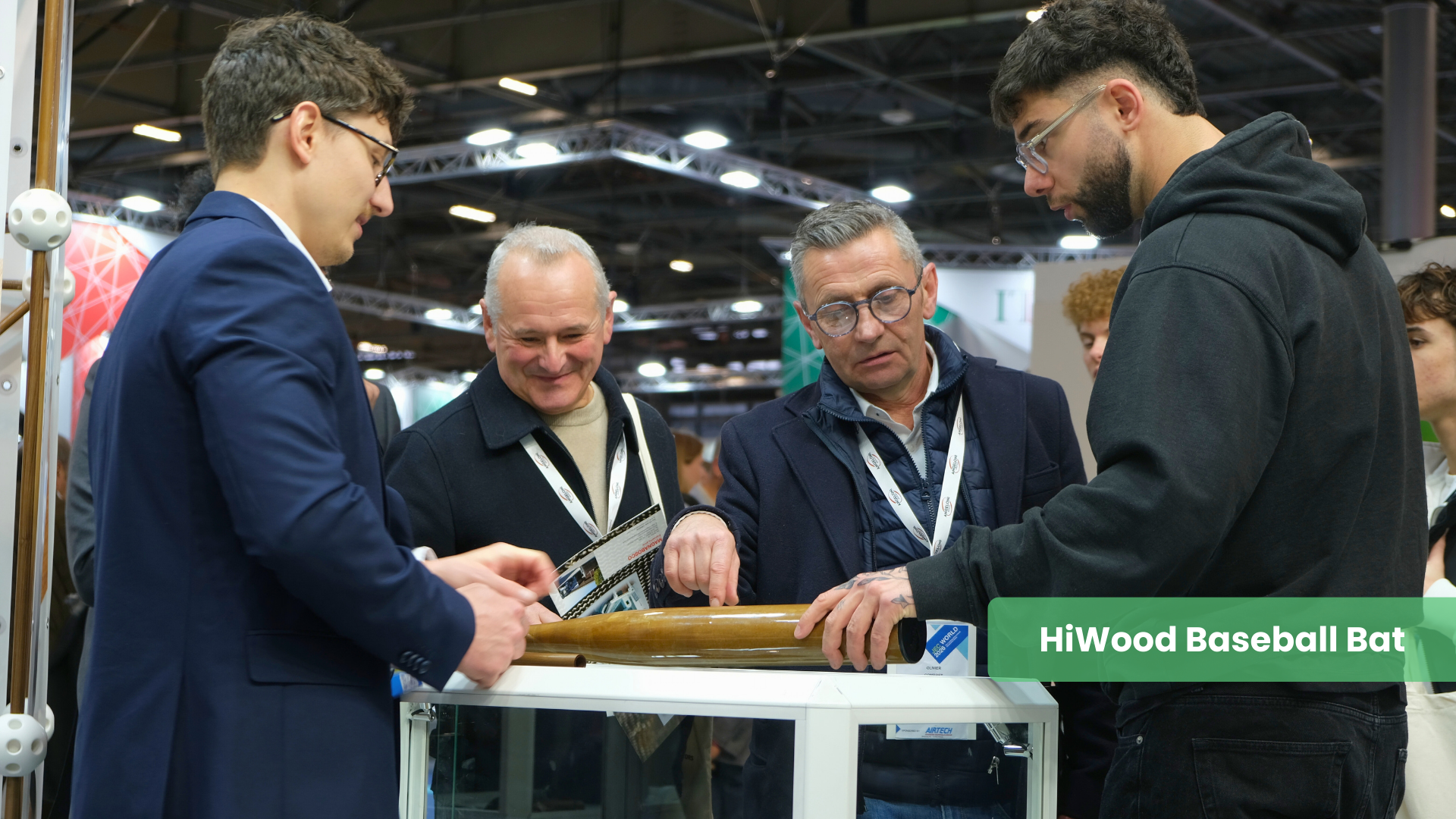 Visitors at JEC World look closely at a HiWood baseball bat, an example of high-performance sporting good prototyping