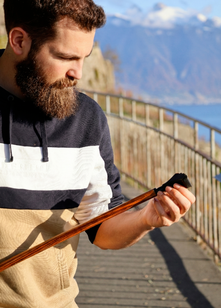 Nordic walker examining HiWood biomaterial used in a HiWalking pole
