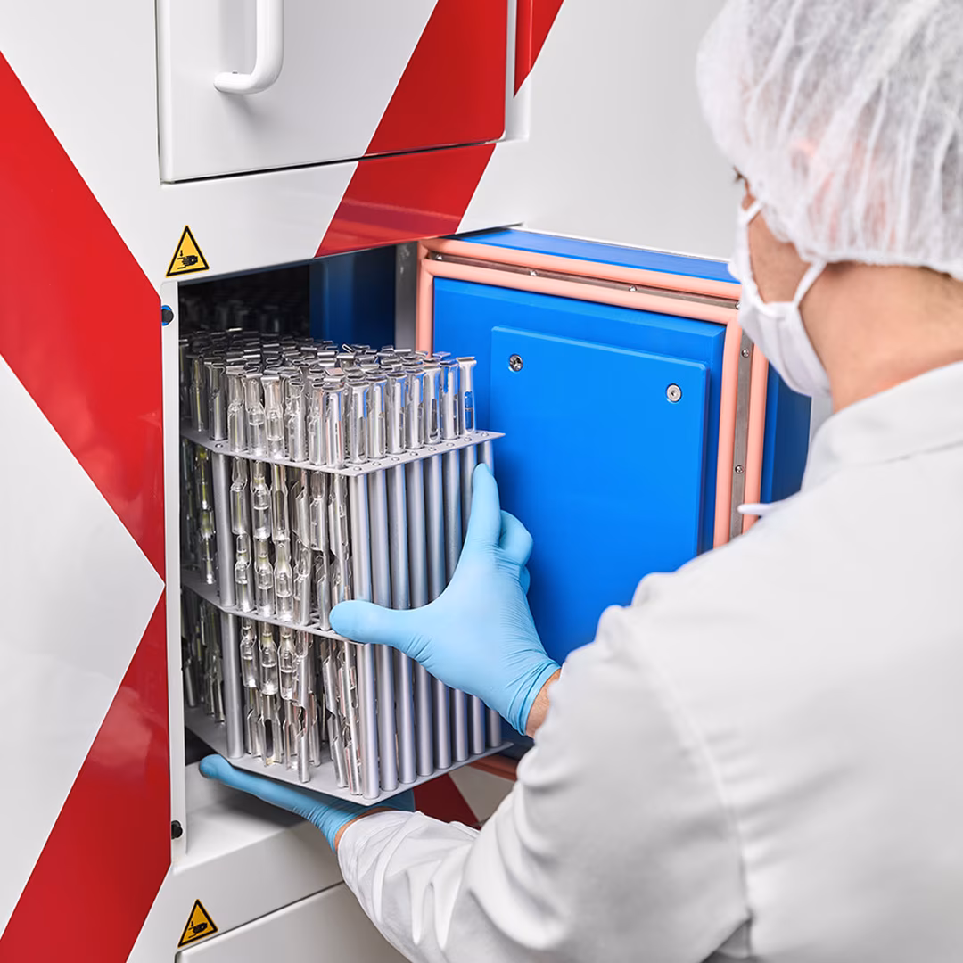 Biotech employee puts bio samples inside ASRS Controlled Rate Freezer