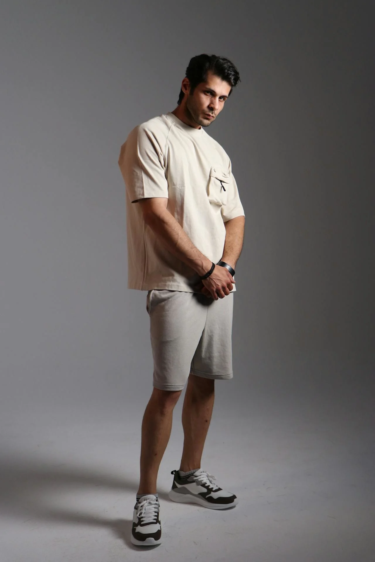 Man showcasing oversized sweatshirt from Sinners collection