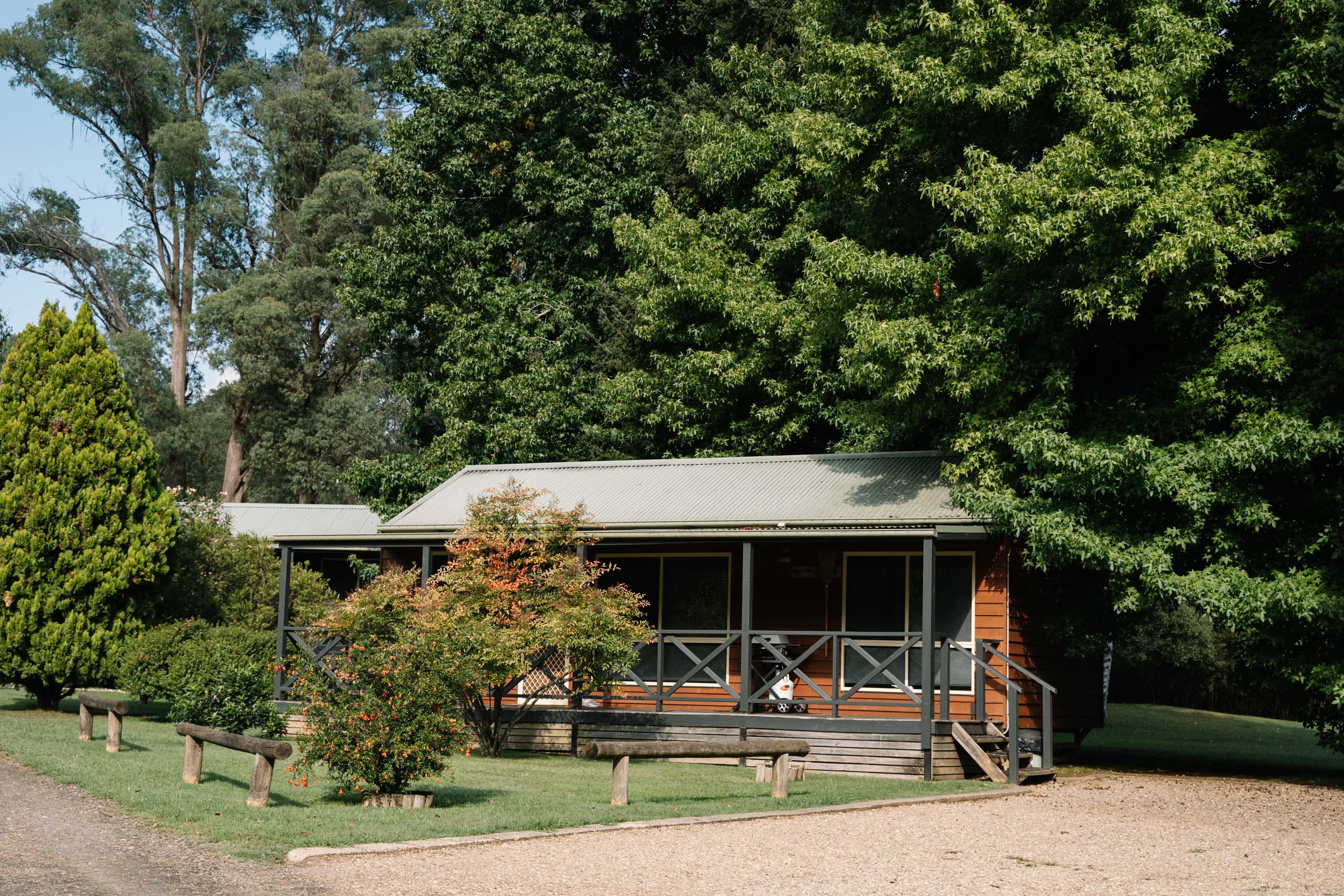 Exterior of accomodation with Queen bed and two sets of bunks in a family-style cabin at Harrietville Cabins, Victoria