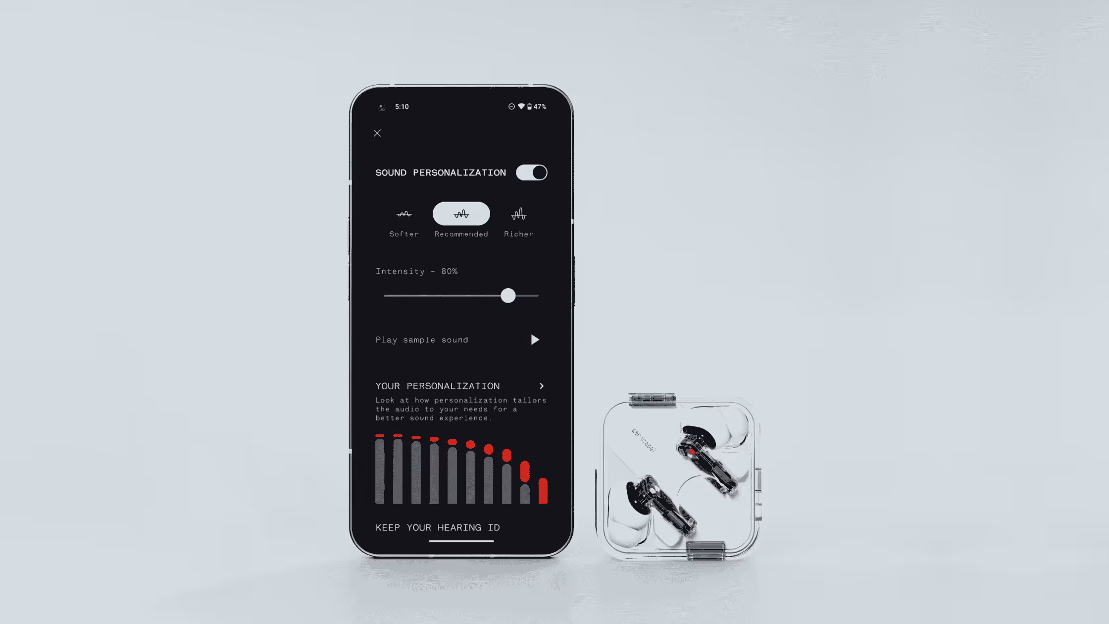 an iphone sitting next to a pair of earbuds