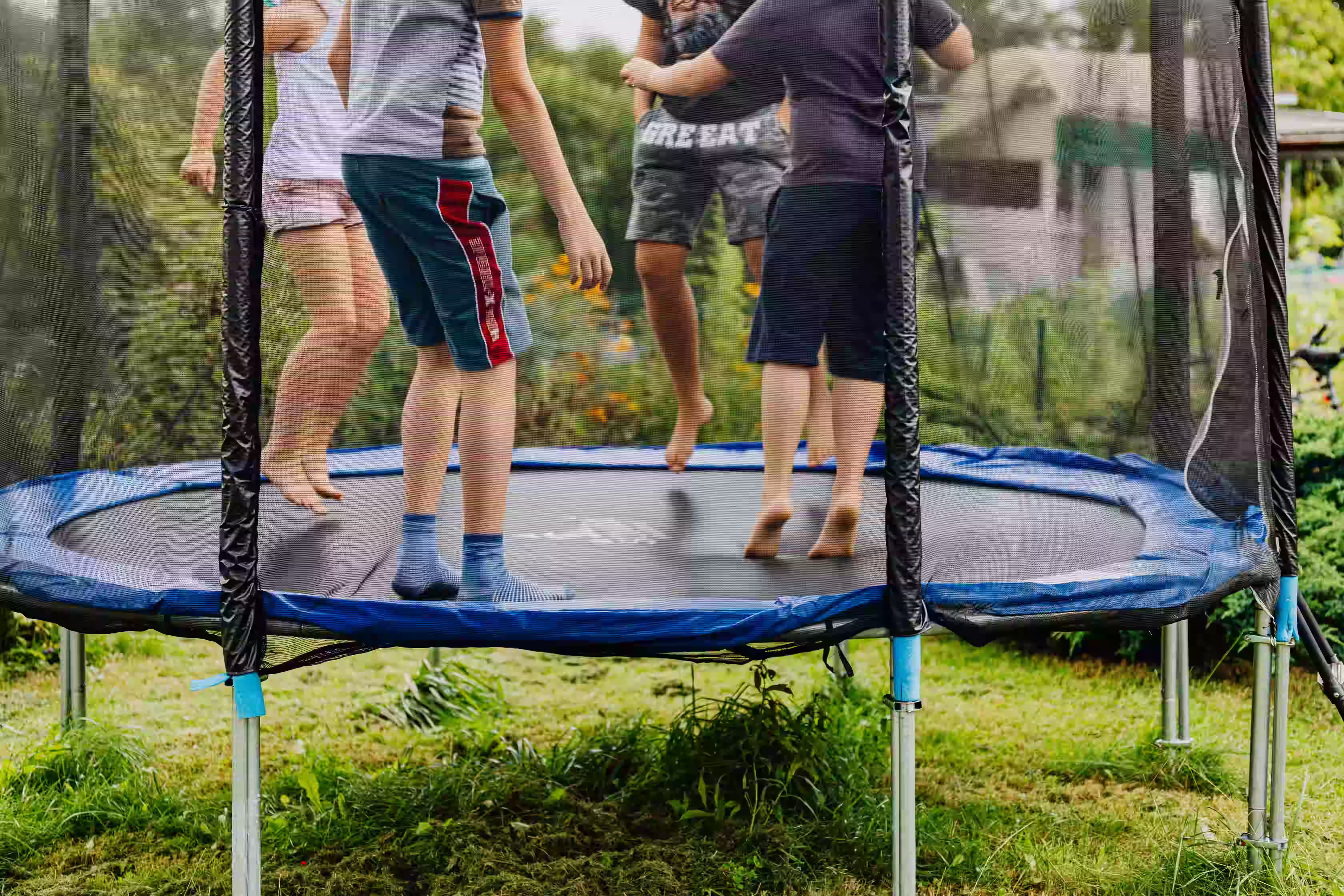 Professional trampoline installation in a backyard by TrampolineInstall.com