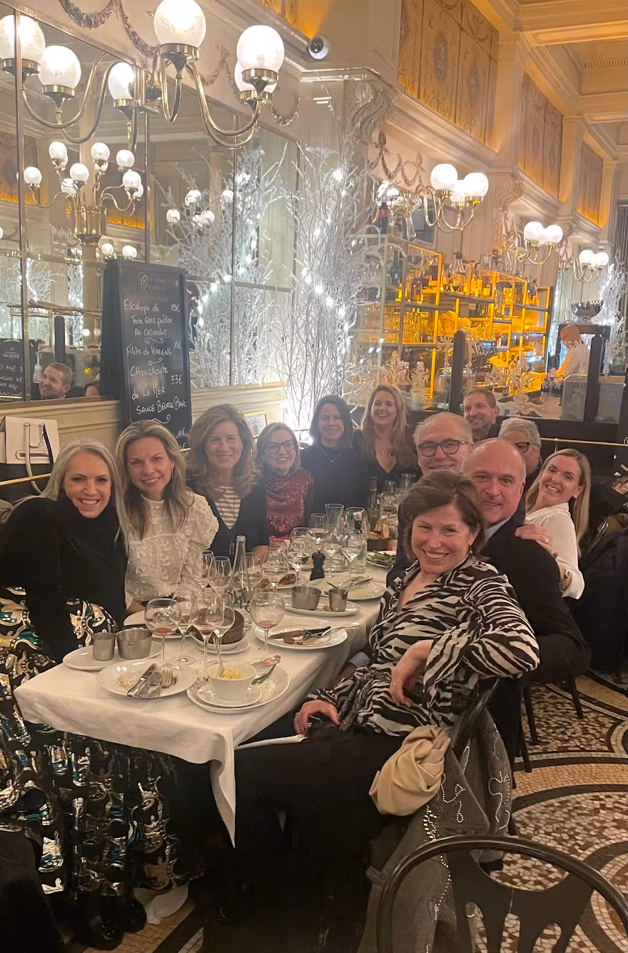 Members gather for dinner in Paris.