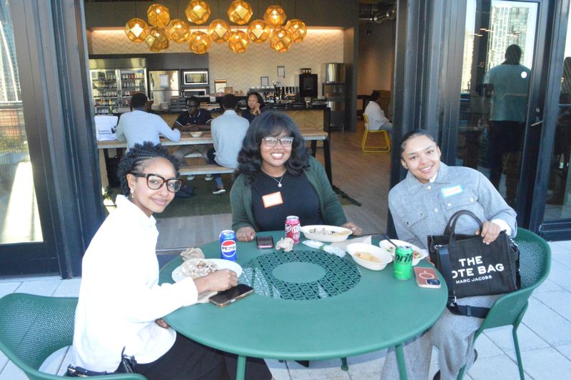 Students and professionals talking at a WCT event