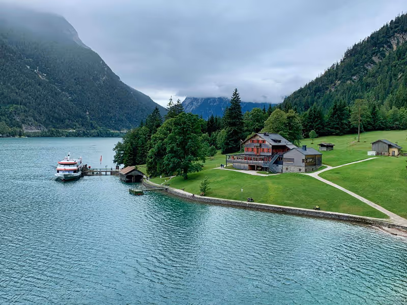 A view of a house by the side of a lake