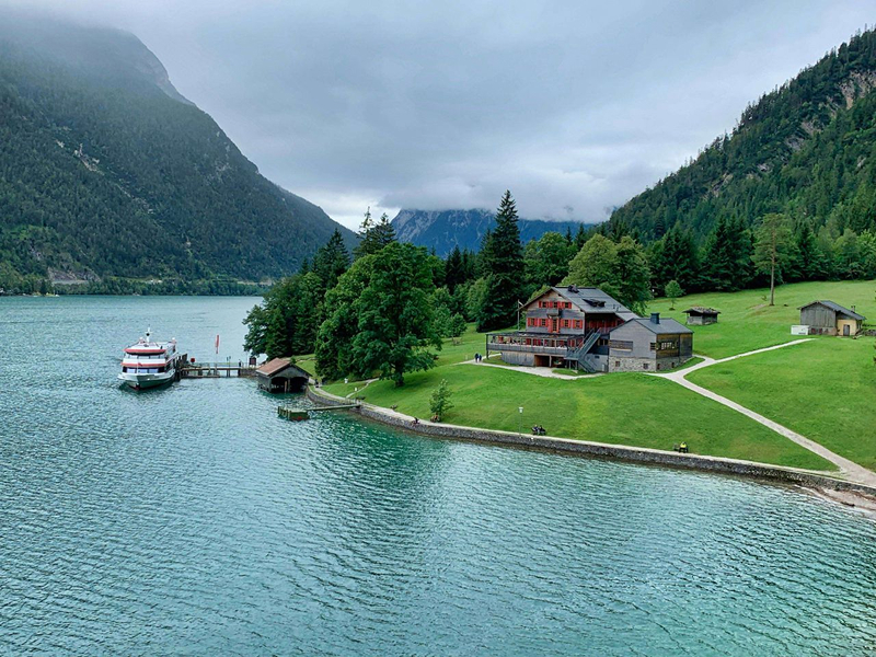 A view of a house by the side of a lake