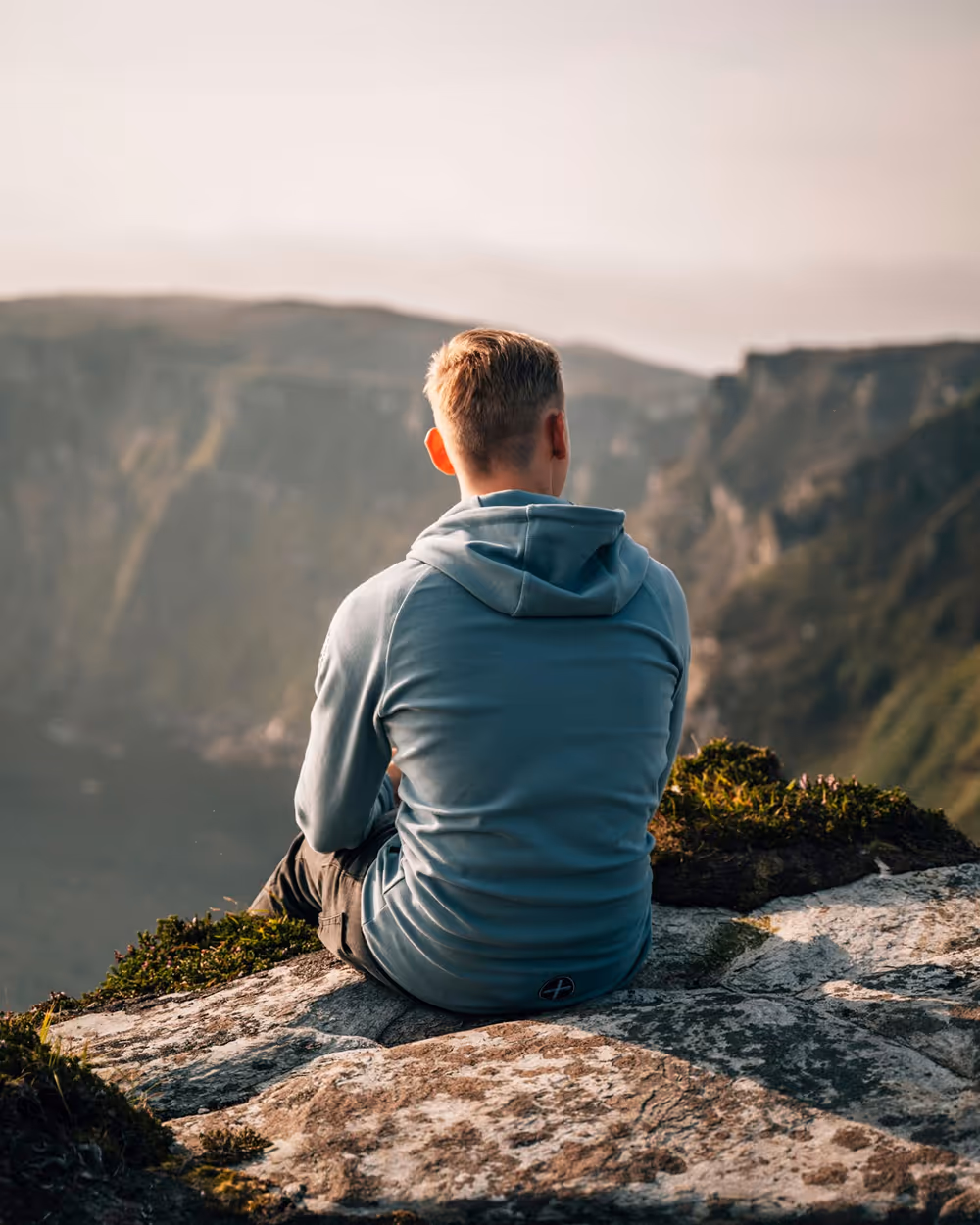 Amen sitting on the ledge looking at the view