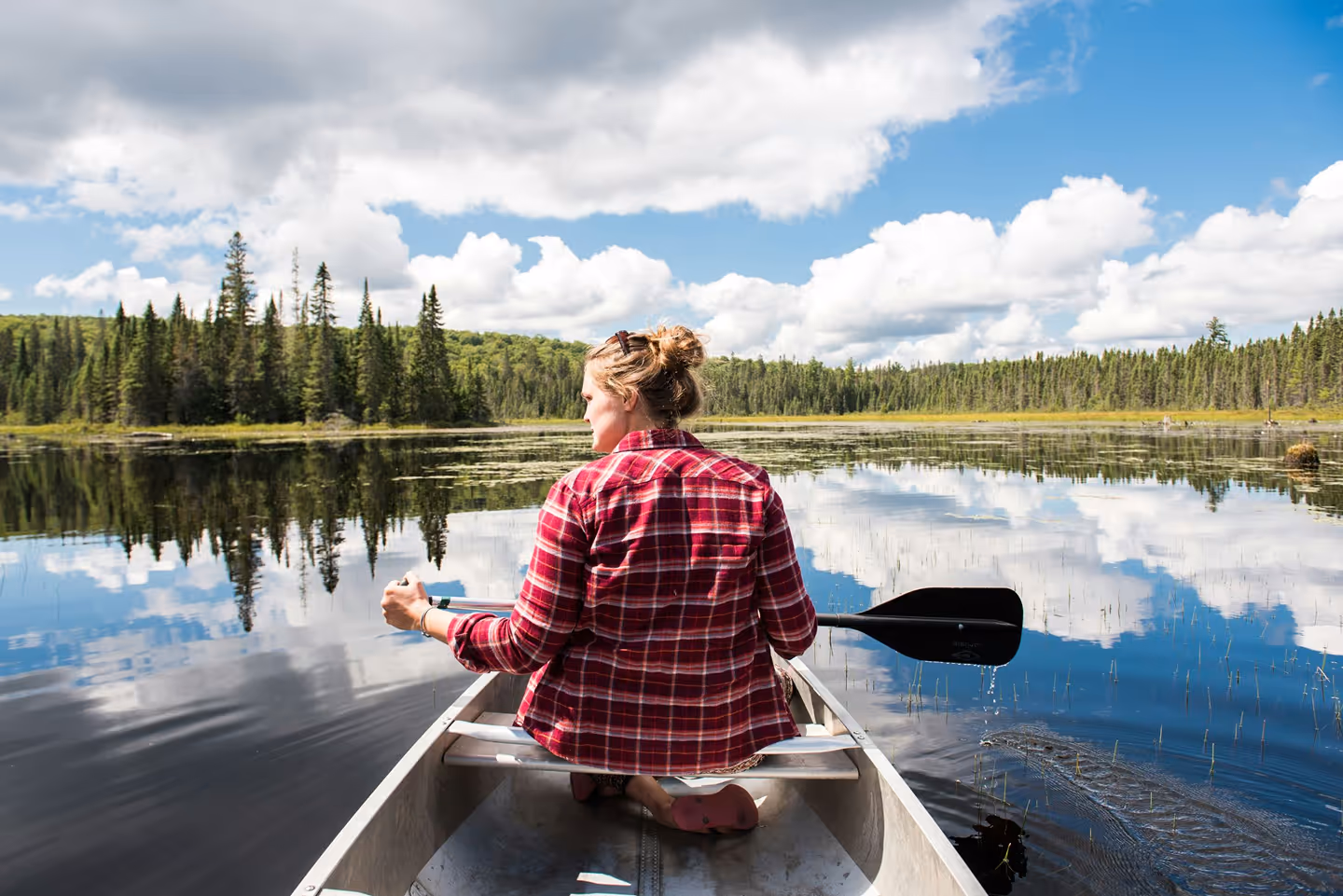 Someone to canoeing on the lake