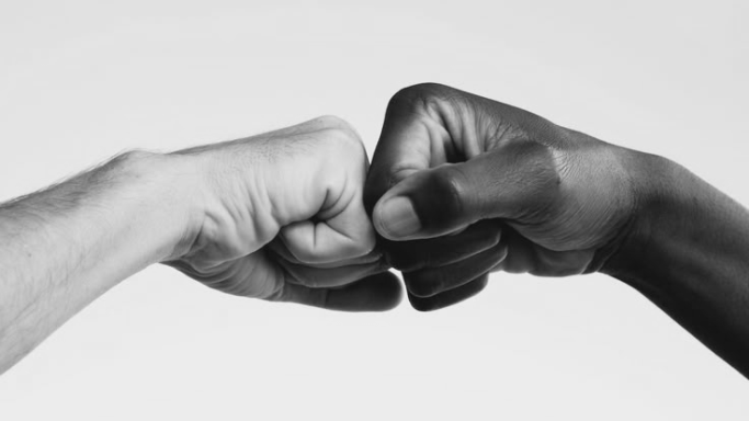 two hands making a fist gesture.