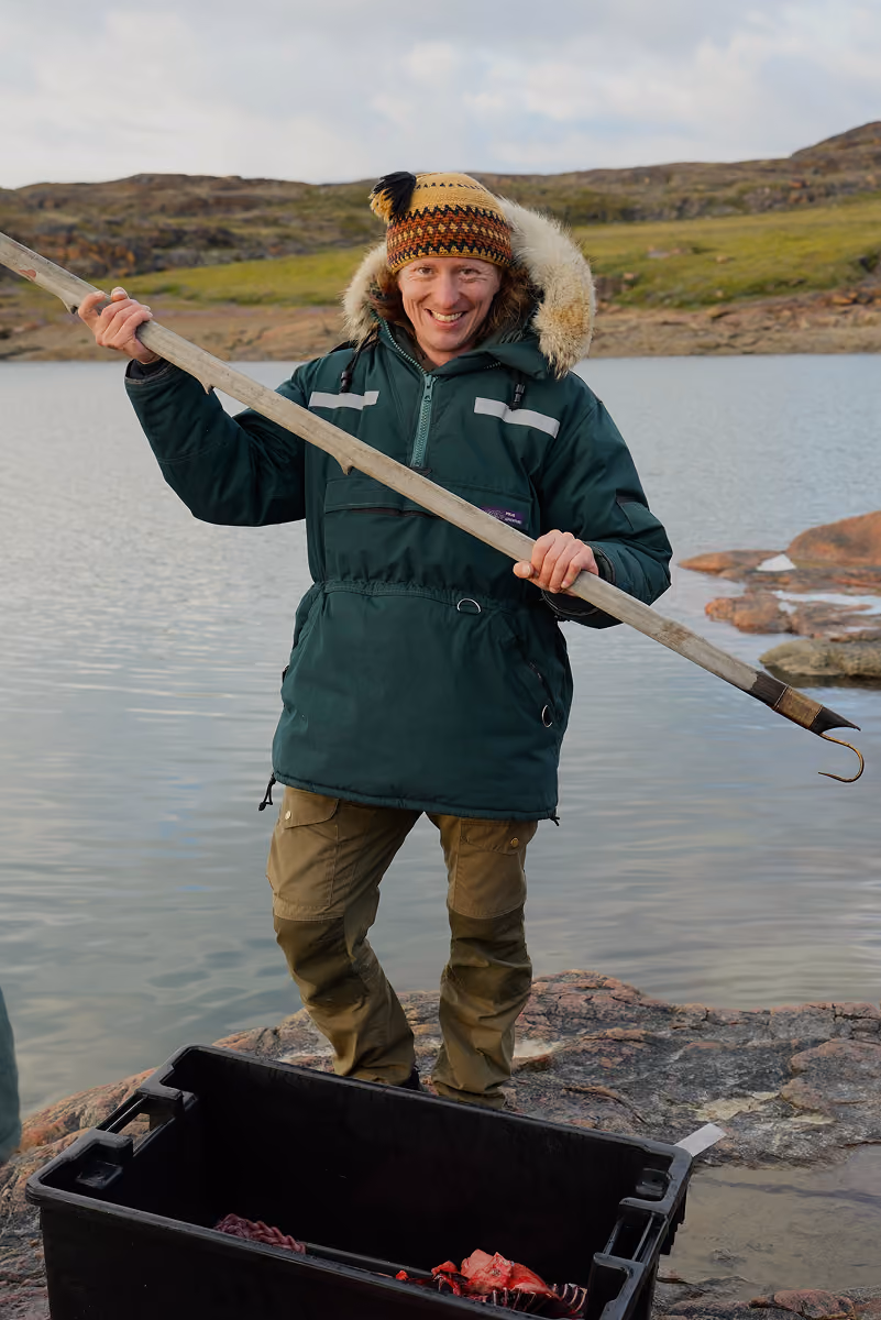 A man holds a traditional spear for fishing