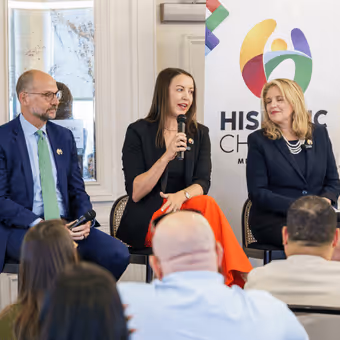 Adrianna Sukula on a panel at a Hispanic Chamber event.