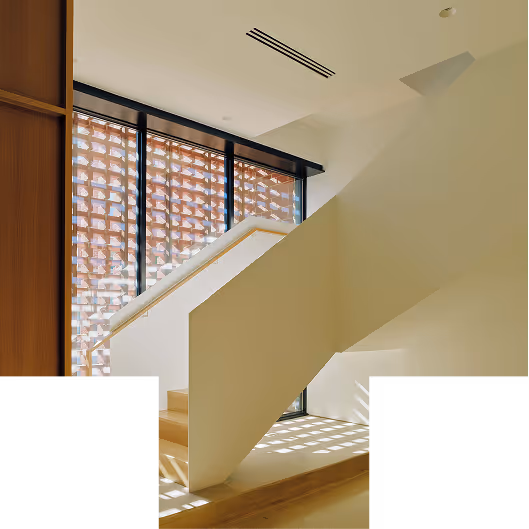 The elegant staircase at Nothing Headquarters cropped into a T shape