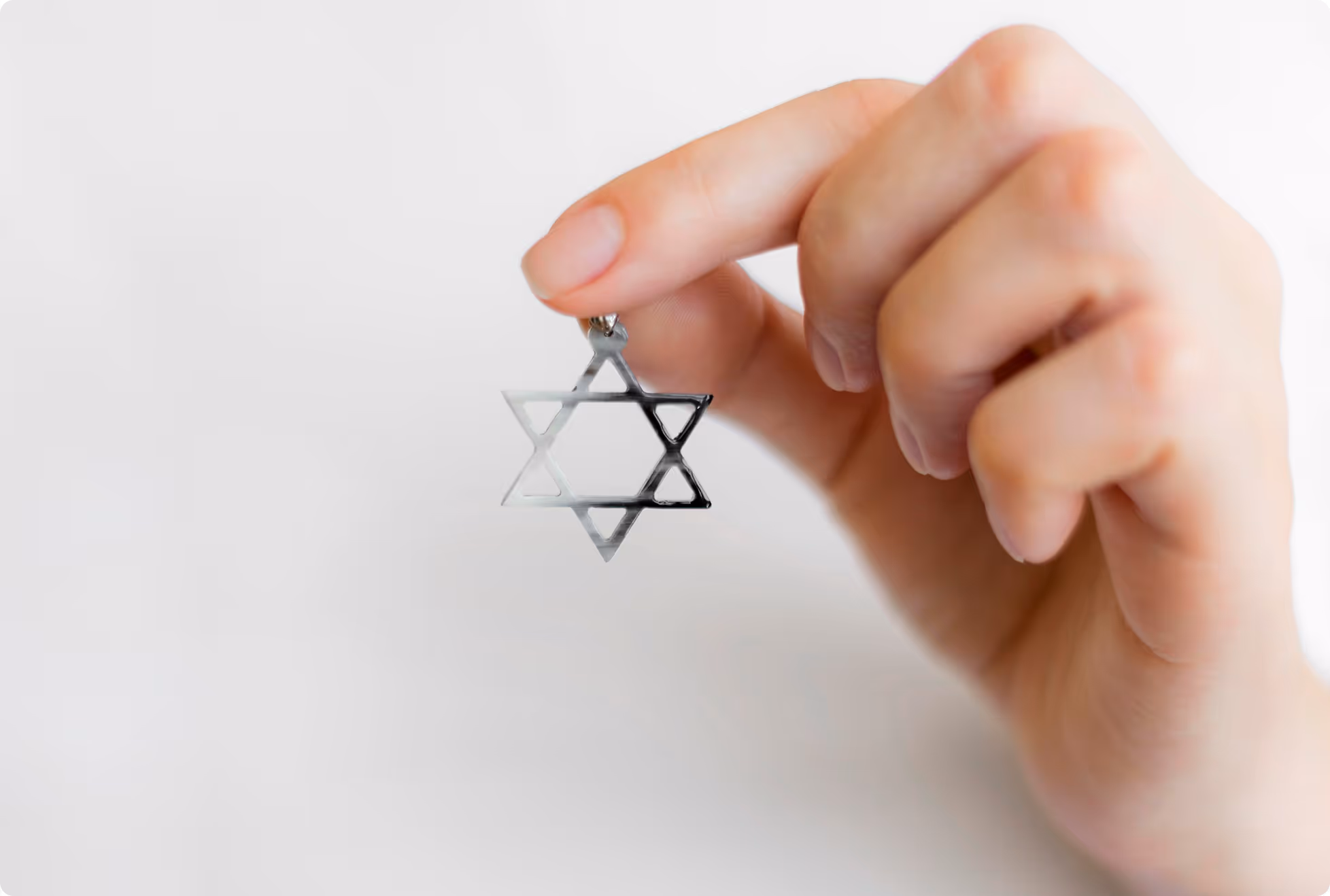 Hand holding a Jewish star