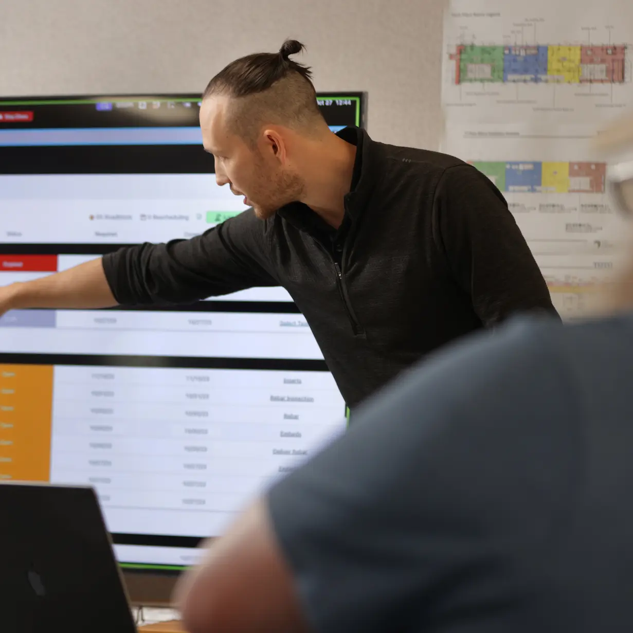 Mike from customer success at Outbuild showing the software 