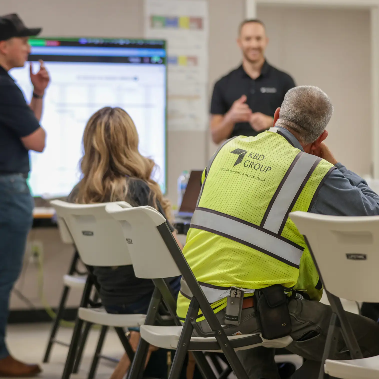 Mike from Customer Success presenting Outbuild construction scheduling software at the job site of KBD Group