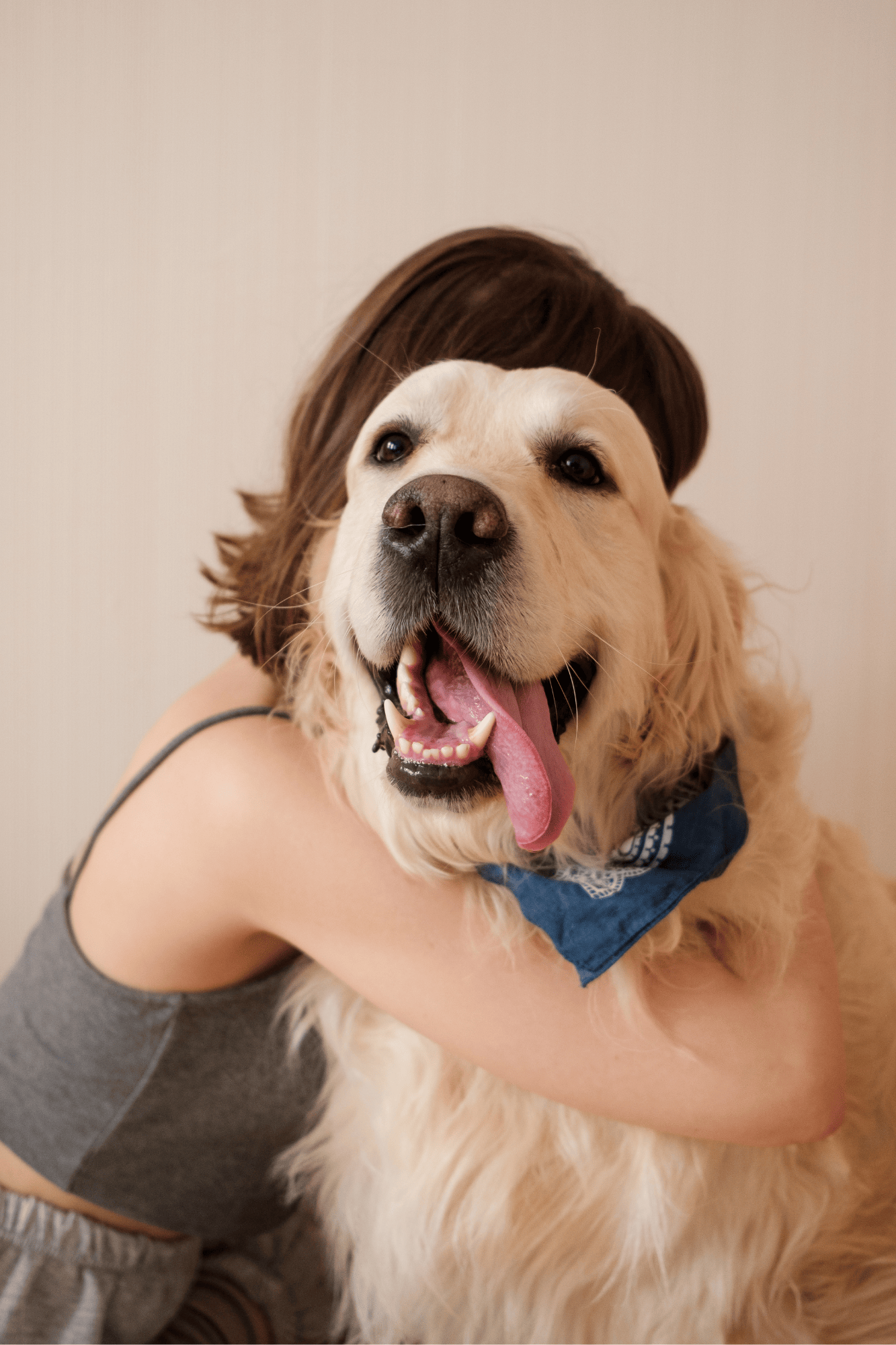 Dog and human cuddle.