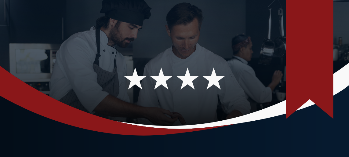 Chefs working in a commercial kitchen with five white stars and red, white, and blue banner, symbolizing American-made restaurant equipment and supplies