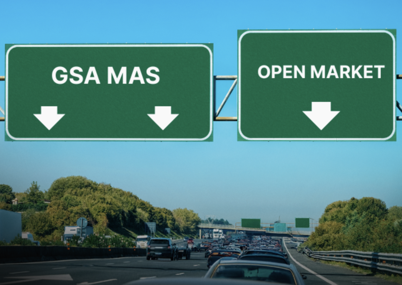 Highway signs labeled GSA MAS and Open Market over traffic, symbolizing government buyers choosing faster procurement under FAR Part 8 and Part 12 updates.