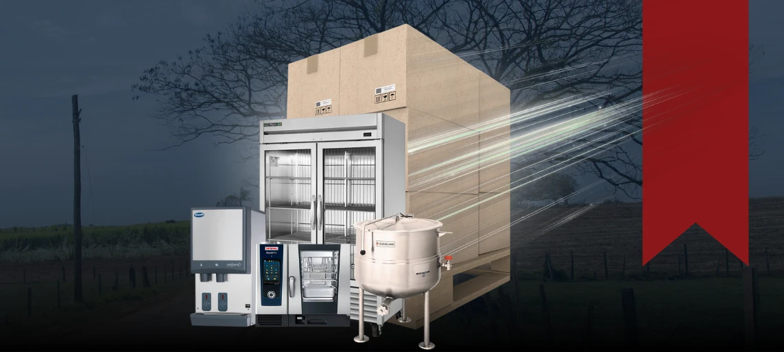 Commercial kitchen equipment including walk-in cooler, combi oven, and tilting kettle arranged in front of rural American farmland and barn