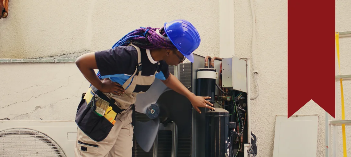Technician inspecting utilities and connections during an ice machine pre-installation check