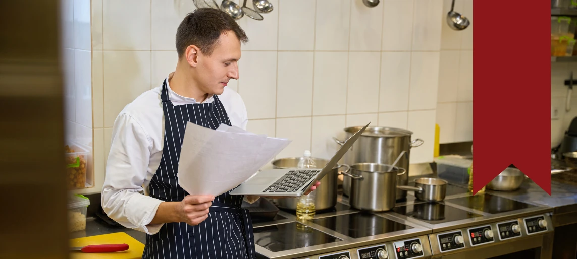 Cannabis kitchen operator reviewing production plans and equipment specifications, reflecting strategic layout and compliance planning experience with Aldevra.