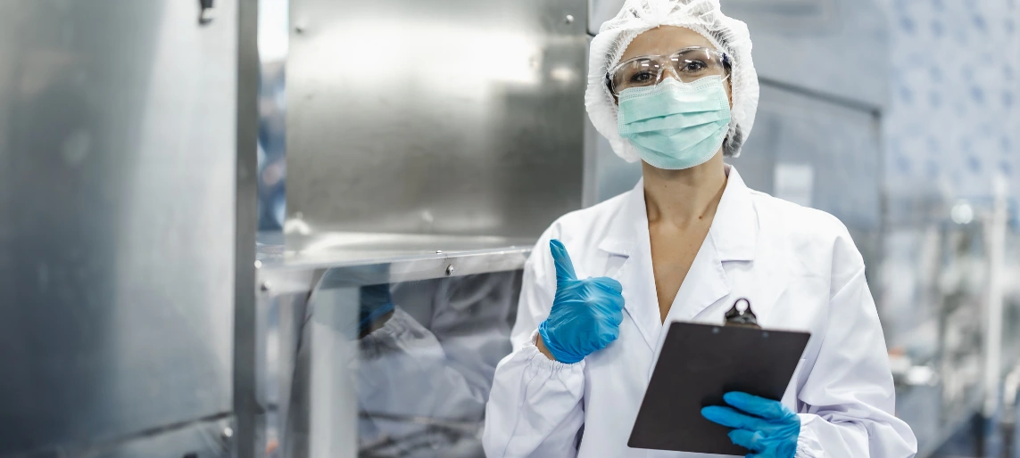 Cannabis edibles quality control inspector verifying HACCP procedures and sanitation standards in a compliant production facility with Aldevra.