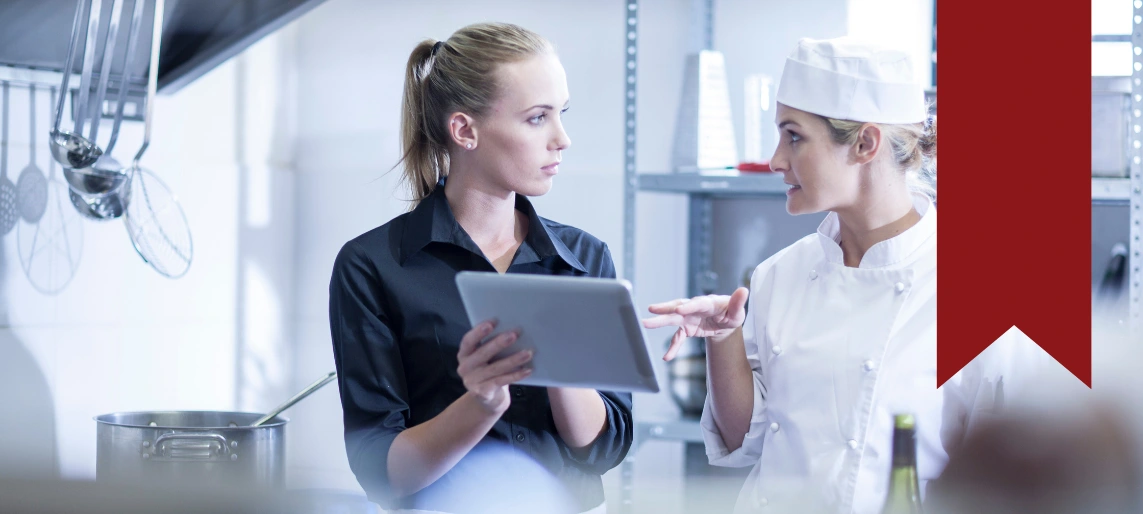 Cannabis kitchen operators consulting with equipment specialist to plan compliant layout, production capacity, and workflow supported by Aldevra.