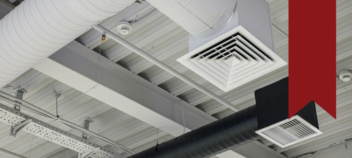Commercial ventilation ductwork and ceiling air grilles supporting proper airflow, odor control, and code compliance in cannabis kitchen facilities with Aldevra.